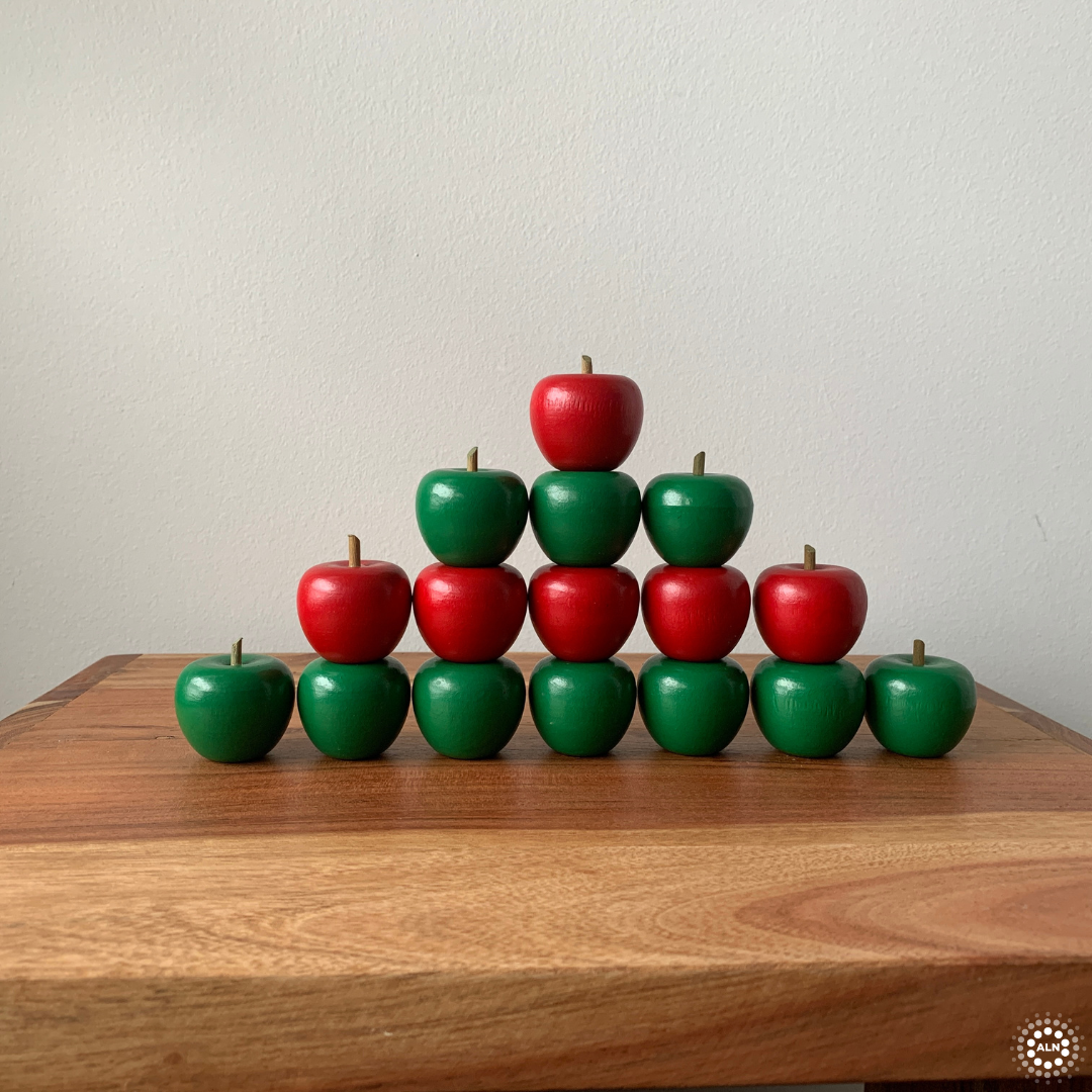 rows of stacked wooden apples