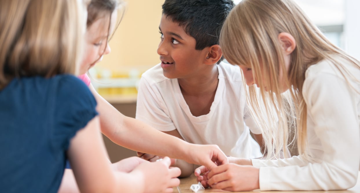 Group of kids playing with dice