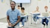 Teacher in classroom with students