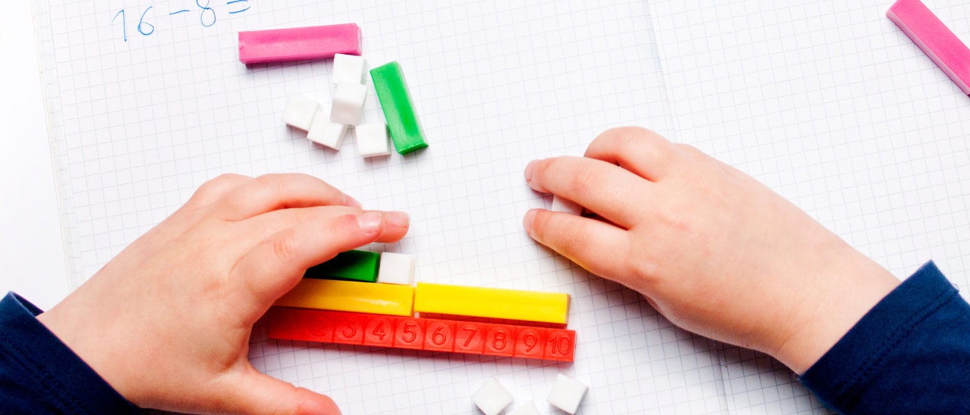 A young child learns with math manipulatives